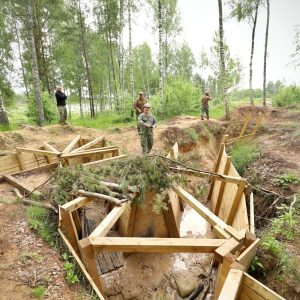 Modern combat engineers reinforcing drone-proof field bunkers in Ukraine