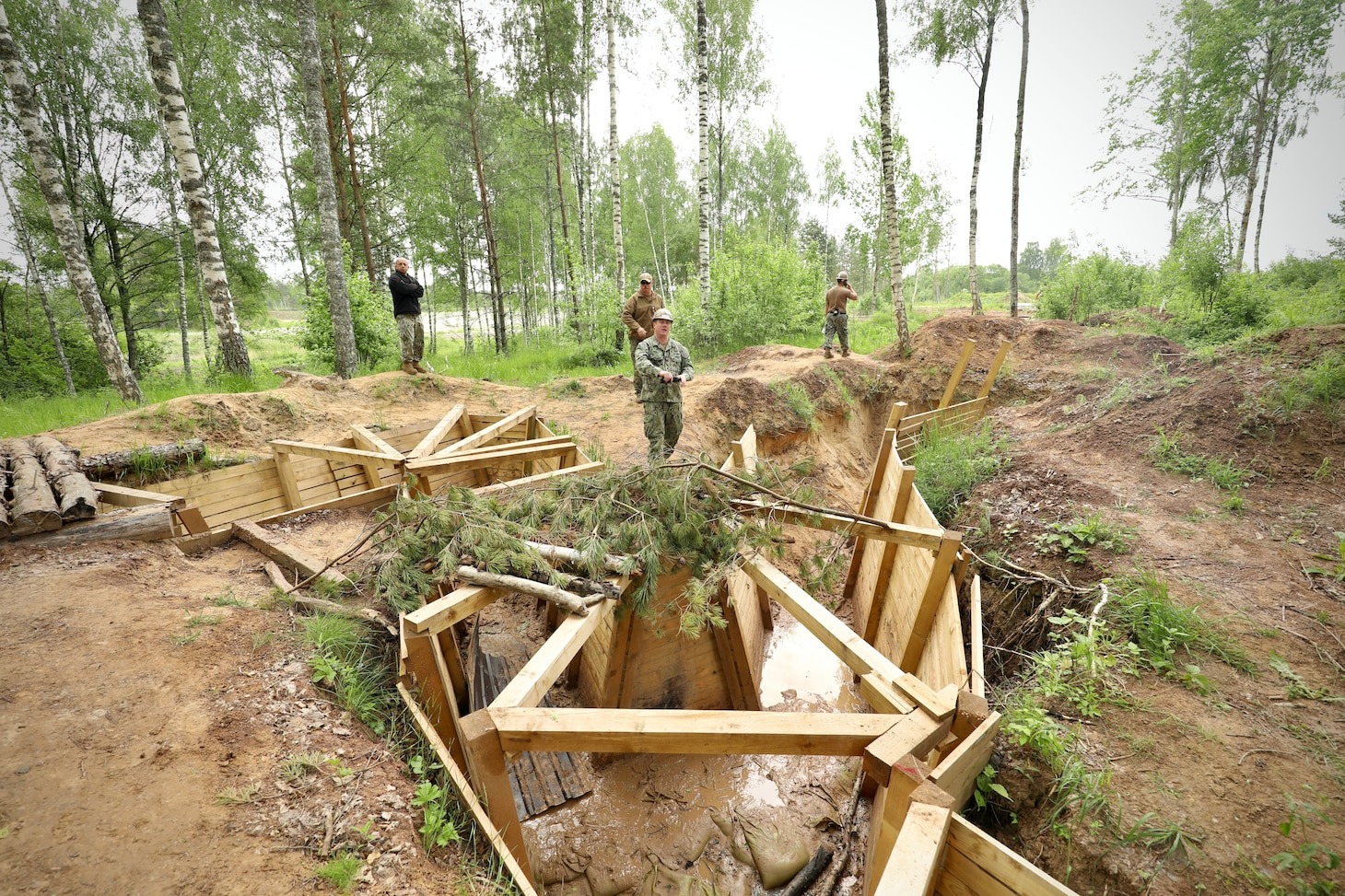 Modern combat engineers reinforcing drone-proof field bunkers in Ukraine