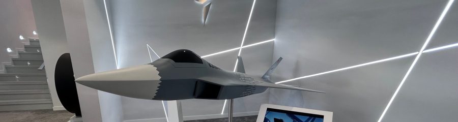 KAAN fighter jet on display with Turkish flag background
